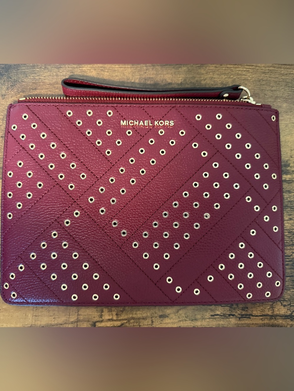 Michael Kors Wine Red Grommet Zip Wristlet
